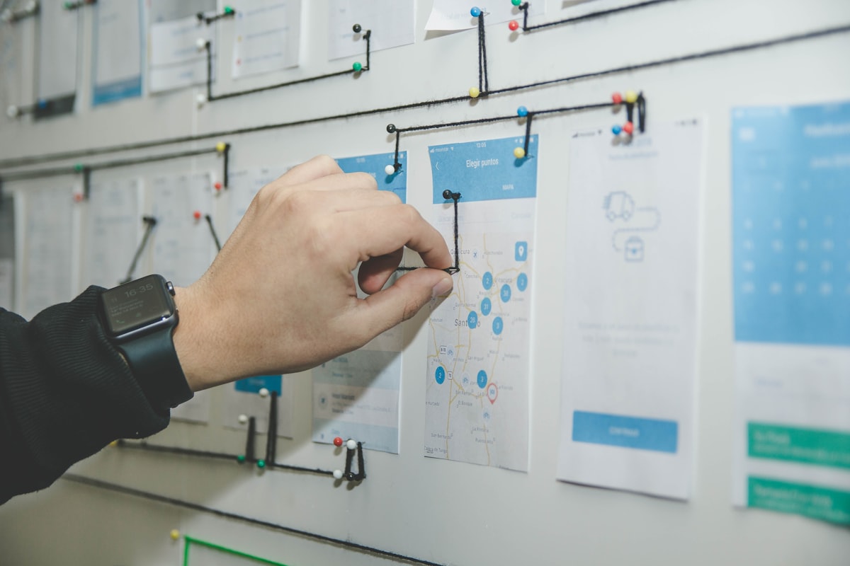 Strategist sketching a content plan on a whiteboard